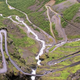 Image for article titled Crazy guy rides a bicycle backwards down a steep mountain